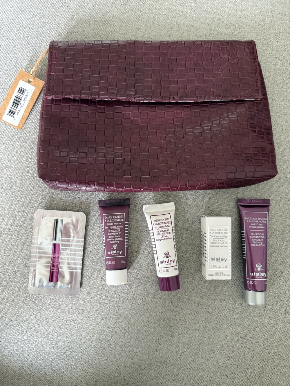 Sisley Woven Plum Cosmetic Clutch with Skincare samples
